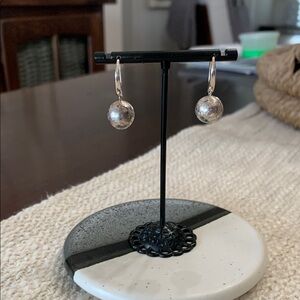 Elegant Sterling Silver Hoop Earrings with antique appearance.